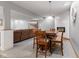 Finished basement with a dining table, fireplace, and comfortable seating area for relaxation at 1682 S Fox Cove Blvd, New Palestine, IN 46163