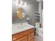 Bright bathroom with a wood vanity and stylish fixtures at 1682 S Fox Cove Blvd, New Palestine, IN 46163