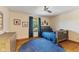 Bedroom with wood floors, blue bedding, and a window with natural light at 1682 S Fox Cove Blvd, New Palestine, IN 46163