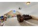 A carpeted bonus room offers versatility, with ample space for seating and play at 1682 S Fox Cove Blvd, New Palestine, IN 46163