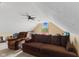 Carpeted bonus room with window, ceiling fan and space for relaxation at 1682 S Fox Cove Blvd, New Palestine, IN 46163