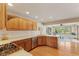 Well-lit kitchen featuring wood cabinets, stainless steel appliances, and granite countertops at 1682 S Fox Cove Blvd, New Palestine, IN 46163