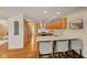 Spacious kitchen with granite countertops, stainless steel appliances, and seating at the bar at 1682 S Fox Cove Blvd, New Palestine, IN 46163