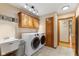 Laundry room with washer and dryer, sink, cabinets and doorway at 1682 S Fox Cove Blvd, New Palestine, IN 46163