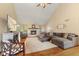 Spacious living room with vaulted ceilings, fireplace, hardwood floors, and comfortable seating at 1682 S Fox Cove Blvd, New Palestine, IN 46163
