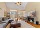 Open living room featuring hardwood floors, comfortable seating, and view into dining area at 1682 S Fox Cove Blvd, New Palestine, IN 46163