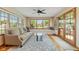 Bright living room with large windows, window seats, hardwood floors and glass doors at 1682 S Fox Cove Blvd, New Palestine, IN 46163
