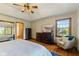 Bedroom featuring vaulted ceiling, hardwood floors, a TV and a comfortable reading chair at 1682 S Fox Cove Blvd, New Palestine, IN 46163