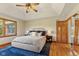 Spacious bedroom with vaulted ceiling, hardwood floors, natural light and access to closet at 1682 S Fox Cove Blvd, New Palestine, IN 46163