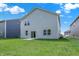 This backyard features a large lawn and a view of the back of the home at 16929 Sandhurst Pl, Westfield, IN 46074