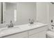 This bathroom features a double sink vanity with white cabinets and a large mirror at 16929 Sandhurst Pl, Westfield, IN 46074