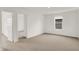 An expansive bedroom with an exterior view and an open doorway leading to additional living space at 16929 Sandhurst Pl, Westfield, IN 46074