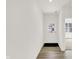 Bright foyer features hardwood flooring and a white front door with glass panes at 16929 Sandhurst Pl, Westfield, IN 46074