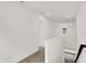 Bright hallway with white walls, trim, and carpeted floors at 16929 Sandhurst Pl, Westfield, IN 46074