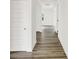 Hallway with hardwood flooring leads to various rooms at 16929 Sandhurst Pl, Westfield, IN 46074