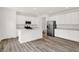 A well-lit kitchen featuring white cabinets, stainless steel appliances, and a functional island at 16929 Sandhurst Pl, Westfield, IN 46074
