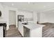 Well-lit kitchen showcasing an island with a sink, stainless steel appliances, and ample cabinet space at 16929 Sandhurst Pl, Westfield, IN 46074