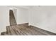 Minimalist living room with hardwood floors and carpeted stairs at 16929 Sandhurst Pl, Westfield, IN 46074