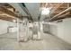 Spacious unfinished basement area features concrete floor, mechanicals, and painted walls at 171 Nursery Rd, Anderson, IN 46012