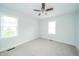 This bedroom has carpeted floors and windows that provide lots of natural light and a ceiling fan at 171 Nursery Rd, Anderson, IN 46012