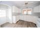 Bright kitchen features white cabinets, appliances and a window above the sink that provides natural light at 171 Nursery Rd, Anderson, IN 46012
