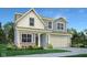 Charming two-story home with neutral siding, manicured lawn, and a welcoming covered porch at 19828 Moorpark Lndg, Noblesville, IN 46062