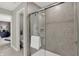 Modern bathroom features neutral tones, quartz countertops, and a walk-in shower with gray tile at 19838 Moorpark Lndg, Noblesville, IN 46062