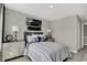 This bedroom features neutral tones, decorative furniture, and modern wall art at 19838 Moorpark Lndg, Noblesville, IN 46062