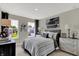 This bedroom features neutral tones, natural light, and unique decorative touches at 19838 Moorpark Lndg, Noblesville, IN 46062