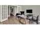 Bright office featuring neutral walls, wood floors, glass desk and french doors at 19838 Moorpark Lndg, Noblesville, IN 46062