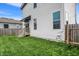 Back exterior of home features a wooden deck with stairs and grassy yard at 2008 Yandes St, Indianapolis, IN 46202