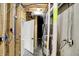 Basement mechanicals with unfinished framing, including furnace and plumbing at 2008 Yandes St, Indianapolis, IN 46202