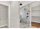 Modern bathroom featuring a glass-enclosed shower, walk-in closet with custom shelving at 2008 Yandes St, Indianapolis, IN 46202