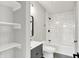 Bathroom featuring white subway tiles in shower, modern vanity, and stylish black finishes at 2008 Yandes St, Indianapolis, IN 46202
