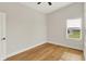 Bright, spacious bedroom featuring hardwood floors and a modern ceiling fan at 2008 Yandes St, Indianapolis, IN 46202