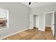 Bright bedroom features hardwood floors, a window, and two closets for ample storage at 2008 Yandes St, Indianapolis, IN 46202