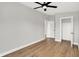 Bright, spacious bedroom featuring hardwood floors and a modern ceiling fan and a walk-in closet at 2008 Yandes St, Indianapolis, IN 46202