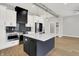 Modern kitchen with stainless steel appliances, stylish backsplash, and a large island at 2008 Yandes St, Indianapolis, IN 46202