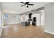 Open-concept living space featuring hardwood floors and a modern kitchen with stainless appliances at 2008 Yandes St, Indianapolis, IN 46202