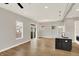 Open-concept living space featuring hardwood floors and a modern kitchen island at 2008 Yandes St, Indianapolis, IN 46202
