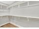 Bright walk-in closet featuring custom shelving and ample storage space at 2008 Yandes St, Indianapolis, IN 46202
