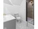 Modern bathroom with elegant tiling, glass enclosed shower, and updated fixtures at 206 N Beville Ave, Indianapolis, IN 46201