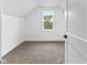 Finished attic bedroom featuring carpeted floors and a window at 206 N Beville Ave, Indianapolis, IN 46201