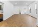 A stylish living area featuring luxury vinyl flooring, complemented by bright natural light at 206 N Beville Ave, Indianapolis, IN 46201