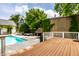 Outdoor space with pool and lounge area offers a tranquil setting for relaxation and entertaining at 214 E St Joseph St, Indianapolis, IN 46202