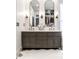 Elegant bathroom featuring double vanity with marble countertop and dual mirrors at 214 E St Joseph St, Indianapolis, IN 46202