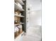 Spa-like bathroom with open shelving, wood accents, and luxury shower system at 214 E St Joseph St, Indianapolis, IN 46202