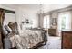 Bright bedroom features hardwood floors, detailed rug, fireplace, and a cozy reading nook at 214 E St Joseph St, Indianapolis, IN 46202