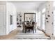 Dining area with built-in bookcase, large mirror, and neutral-toned rug at 214 E St Joseph St, Indianapolis, IN 46202