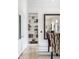 Dining area with built-in bookcase and large mirror at 214 E St Joseph St, Indianapolis, IN 46202